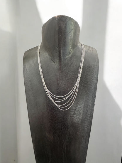 Collier rangs multiple acier argenté